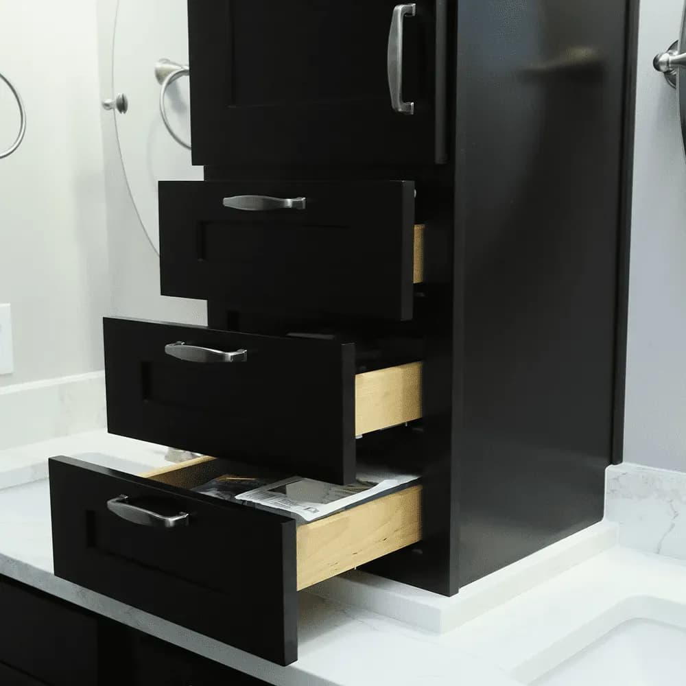 A set of black, custom vanity drawers.